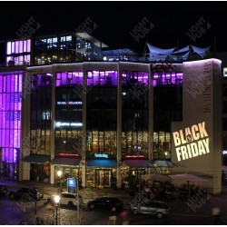 Projection lumineuse publicité black friday sur façade centre commercial boutique magasin