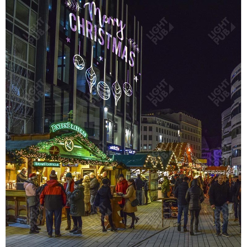 Projection lumineuse thème Noël sur bâtiment pour marché de Noël Projection lumineuse thème Noël sur bâtiment pour marché de Noël